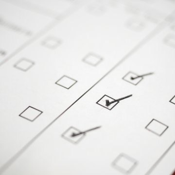 check signs boxes checked on white piece of paper background check service truthfinder features